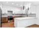 Modern kitchen with white and wood cabinets and island at 1420 Pierce St, Lakewood, CO 80214