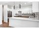 Modern kitchen with white cabinetry and quartz countertops at 1420 Pierce St, Lakewood, CO 80214