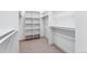 Spacious walk-in closet with built-in shelves and hanging rods at 1420 Pierce St, Lakewood, CO 80214