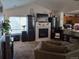 Spacious living room featuring a fireplace and large windows at 18088 Becket Dr, Parker, CO 80134