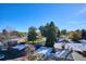 Snow-dusted rooftops of houses and tree-lined street in a residential neighborhood at 799 Dahlia St # 501, Denver, CO 80220