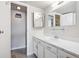 Bathroom with vanity, single sink, and mirrored medicine cabinet at 799 Dahlia St # 501, Denver, CO 80220