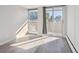 Spacious bedroom with large windows and wood-look laminate flooring at 799 Dahlia St # 501, Denver, CO 80220