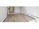 Spacious living area with hardwood floors and view of kitchen at 799 Dahlia St # 501, Denver, CO 80220