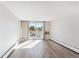 Living room with sliding glass door to balcony at 799 Dahlia St # 501, Denver, CO 80220