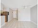 Open living area with tile flooring and access to kitchen at 799 Dahlia St # 501, Denver, CO 80220