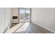 Living room with hardwood floors and sliding glass door to balcony at 799 Dahlia St # 501, Denver, CO 80220