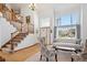 Bright living room with hardwood floors, high ceilings, and a view of the front yard at 16642 Autumn Rock Cv, Parker, CO 80134