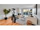 Living room featuring a fireplace, sliding glass door to patio, and modern furniture at 3240 Iris Ave # G201, Boulder, CO 80301