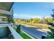 View from balcony showcases a tree-lined street and distant mountain views at 3240 Iris Ave # G201, Boulder, CO 80301