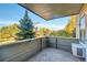 Spacious balcony with concrete flooring and partial treetop views at 3240 Iris Ave # G201, Boulder, CO 80301