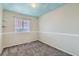 Bedroom with cloud ceiling, window, and carpet at 303 Tumbleweed Dr, Brighton, CO 80601