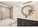 Clean bathroom with updated vanity and shower/tub combo at 2850 W Irvington Pl, Denver, CO 80219