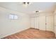 Well-lit bedroom with hardwood floors and ample closet space at 2850 W Irvington Pl, Denver, CO 80219