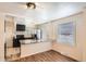 Updated kitchen featuring granite countertops and dark cabinetry at 2850 W Irvington Pl, Denver, CO 80219