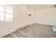 Living room featuring wood-look flooring at 2850 W Irvington Pl, Denver, CO 80219