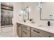 Shared bathroom with double vanity and a shower/tub combo at 9782 Majestic Oak Dr, Parker, CO 80134