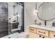 Clean bathroom with a walk-in shower, modern vanity and toilet at 9782 Majestic Oak Dr, Parker, CO 80134