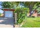 Brick home's exterior featuring a lush green lawn and a stone walkway at 3661 W Greenwood Pl, Denver, CO 80236