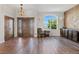 Spacious entryway with wood floors, custom wood wall, and large windows at 6001 S County Road 161, Strasburg, CO 80136
