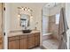 Bathroom with walk-in shower and modern vanity at 6001 S County Road 161, Strasburg, CO 80136