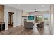 Spacious living area with fireplace, large TV, and access to backyard at 6001 S County Road 161, Strasburg, CO 80136