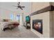 Main bedroom with fireplace and access to balcony at 6001 S County Road 161, Strasburg, CO 80136