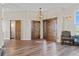 Entryway with tile floor, coat closet, powder room, and built-in shelving at 6001 S County Road 161, Strasburg, CO 80136