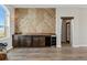 Custom bar with chevron wood wall, sliding doors and wood shelving at 6001 S County Road 161, Strasburg, CO 80136
