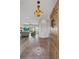 Bright and spacious entryway with tile flooring and a view into the living room at 6001 S County Road 161, Strasburg, CO 80136