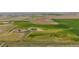 Aerial view of property showing expansive land and new construction at 6001 S County Road 161, Strasburg, CO 80136