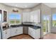 Kitchen with stainless steel appliances and view from window at 6001 S County Road 161, Strasburg, CO 80136