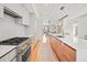 Modern kitchen with island, stainless steel appliances, and hardwood floors at 3232 W 16Th Ave, Denver, CO 80204