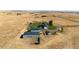 Aerial view of property showing home, detached garage, and expansive land at 6751 S County Road 129, Bennett, CO 80102