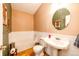 Clean bathroom with pedestal sink and shower/tub combo at 6751 S County Road 129, Bennett, CO 80102