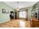 Bright dining room with hardwood floors and large window at 6751 S County Road 129, Bennett, CO 80102
