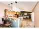 Kitchen with island, stainless steel appliances, and breakfast bar at 6751 S County Road 129, Bennett, CO 80102