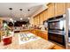 Well-equipped kitchen with an island and a breakfast nook at 6751 S County Road 129, Bennett, CO 80102