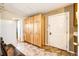 Laundry room with built-in storage and tile flooring at 6751 S County Road 129, Bennett, CO 80102