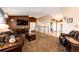 Open living room featuring a fireplace and ample natural light at 6751 S County Road 129, Bennett, CO 80102