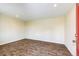 Simple spare room with laminate wood flooring at 6751 S County Road 129, Bennett, CO 80102