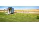 Small storage shed with a wooden deck at 6751 S County Road 129, Bennett, CO 80102