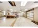 Large workshop with high ceilings, garage door, and ample workspace at 6751 S County Road 129, Bennett, CO 80102