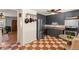 Bright kitchen with stainless steel appliances and checkered floor at 9210 Yucca Way, Thornton, CO 80229