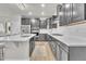 Modern kitchen with gray cabinets, white countertops, and stainless steel appliances at 7215 S Robertsdale Way, Aurora, CO 80016