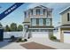 To-be-built two story home with green and gray exterior at , Aurora, CO 80019