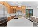 Modern kitchen with light wood cabinets and a large island at 13455 S Resort Dr, Conifer, CO 80433