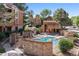 Community pool with stonework and pergola at 4274 S Salida Way # 11, Aurora, CO 80013
