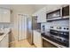 Modern kitchen with stainless steel appliances and granite countertops at 4274 S Salida Way # 11, Aurora, CO 80013