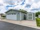 Attached garage with a storage shed and well-maintained lawn at 6165 Needlegrass Grn # 313, Frederick, CO 80530